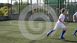 Teens playing soccer football match. Competition between two youth soccer teams. Football soccer tournament