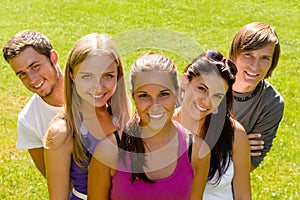 Teens relaxing in the park friends happy