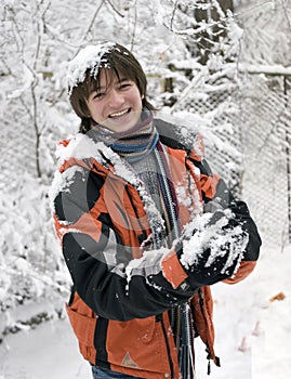 Teens in scarf with snowball