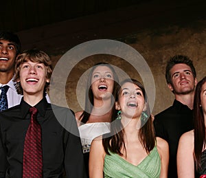 Teens singing at concert