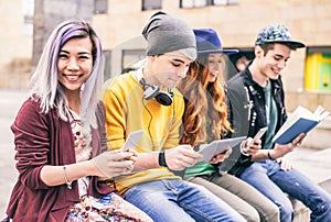 Teens with smartphones and tablet