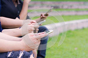 Teens typing on mobile phones