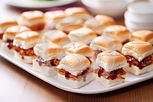 teeny bbq sandwiches for a party, white plates