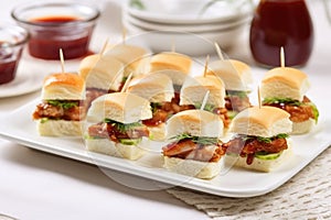 teeny bbq sandwiches for a party, white plates