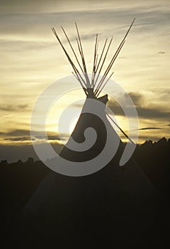 Teepee silhouetted at dusk in Taos, NM photo