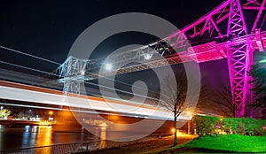 Tees Transporter Bridge under the colorful lights with long exposure at night in Middlesbrough