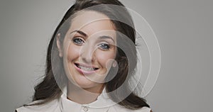 Teeth alignment by braces. Headshot of young female smiling friendly. Dental care, stomatology, orthodontic treatment