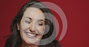 Teeth alignment by braces. Young female smiling. Advertising of dental care and orthodontic treatment