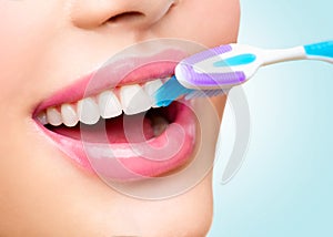 Teeth brushing. White healthy teeth