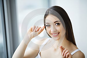 Teeth Care. Beautiful Smiling Woman Flossing Healthy White Teeth