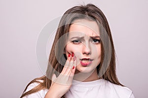 Teeth Problem. Woman Feeling Tooth Pain. Closeup Of A Beautiful Sad Girl Suffering From Strong Tooth Pain. Attractive Female Feeli