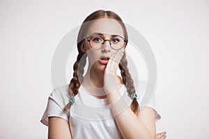 Teeth problem. Woman feeling toothache. Closeup of beautiful sad girl suffering from strong tooth pain. Dental health and care con