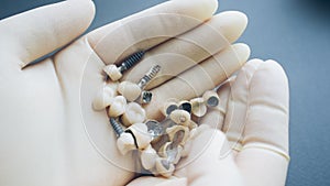 Teeth reconstruction dental ceramic implants hands