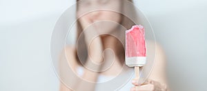 Teeth Sensitive to Cold concept. woman hold Ice cream and having toothache and pain after eat. Tooth Decay or Gum Disease,