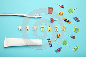 Teeth with sweet candies. Tooth caries in children`s, dental healthcare, toothpaste and toothbrush