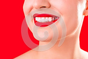 Teeth whitening. Healthy white smile close up. Beauty woman with perfect smile- lips and teeth. Beautiful Model Girl with red lips