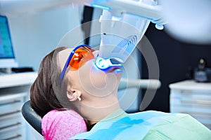 Teeth whitening for patient in protective glasses