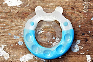 Teether on wooden background