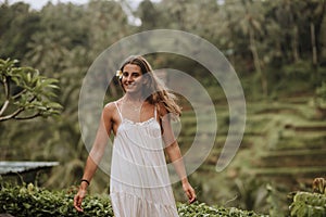 Tegallalang Rice Terrace girl.Beautiful girl visiting the Bali rice fields in tegalalang, ubud