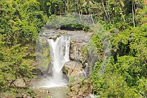 Tegenungan waterfall, Bali, Indonesia. Jungle, forest, daytime with cloudy sky