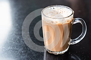 Teh tarik, milk tea with froth. Popular drink in Malaysia