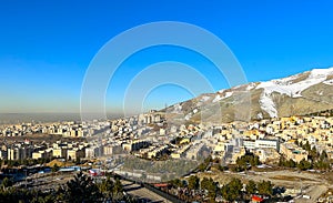 Tehran City View with Snow Alborz Mountains