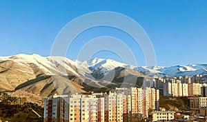 Tehran City View with Snow Alborz Mountains background