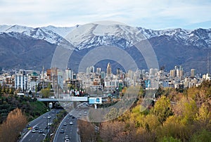 Tehran Skyline and Highway in Front of Snowy Mountains