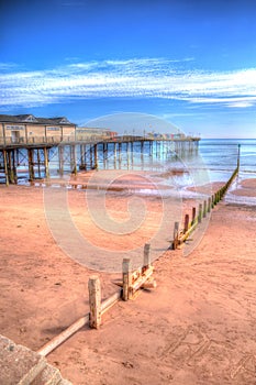 Teignmouth Pier Devon with blue sky and clouds in HDR