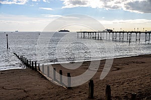 Teignmouth pier with redundant cruise ship