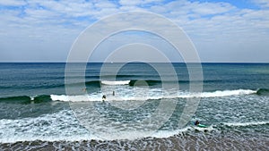 Tel Aviv. Blue sky. White clouds. Birch water. The sun. The waves. Surfing.