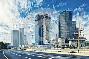 Tel Aviv Cityscape In Daylight, New Skyscraper Under Constraction and Empty Aylon Freeway.