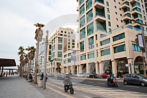 2.01.2023, Tel Aviv, Israel. Tel-Aviv city background. Street near the beach and Mediterranean Sea. Buildings, hotels, people and
