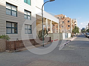 TEL AVIV, ISRAEL. Street with low rise buildings on a summer day