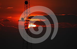 The telacommunication pole or mobile pole with sun set sky background