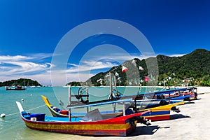 Telaga Harbor beach with colourful squid fishing boats on Langkawi island, also known as Pulau Langkawi, State of Kedah, Malaysia