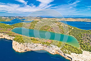 Telascica nature park cliffs and green Mir lake on Dugi Otok island aerial view