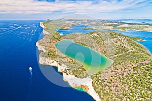 Telascica nature park cliffs and green Mir lake on Dugi Otok island aerial view