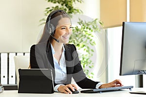 Tele marketer working at office with computer photo