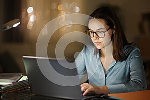 Tele worker working with eyeglasses in the night