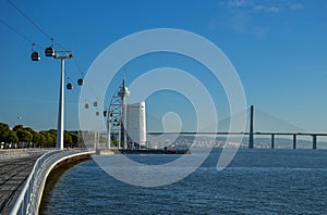 Telecabines cable cars at Park of Nations Parque das Nacoes and Vasco da Gama Bridge over the Tagus River, in Lisbon, Portugal