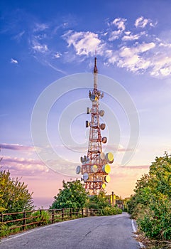 Telecom radio tower during sunset hour on top of Genoa mounte fregoso in genova