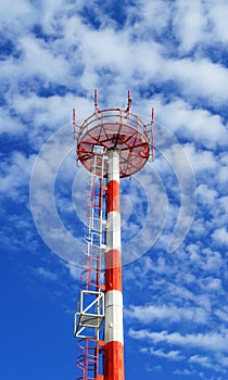 Telecom tower on blue sky background