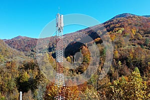 The telecom tower with blue sky. Telecommunications antenna tower in the morning.