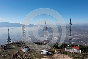 The telecom tower with blue sky. Telecommunications antenna tower in the morning.