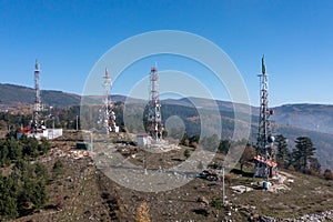 The telecom tower with blue sky. Telecommunications antenna tower in the morning.