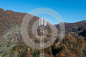 The telecom tower with blue sky. Telecommunications antenna tower in the morning.