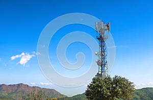 A telecomm tower phone network on blue sky and cloud