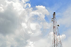 Telecommunication antenna with cloudy blue sky