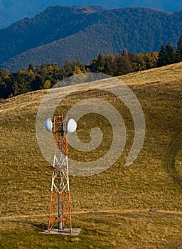 Telecommunication antenna (GSM) on mountain meadow